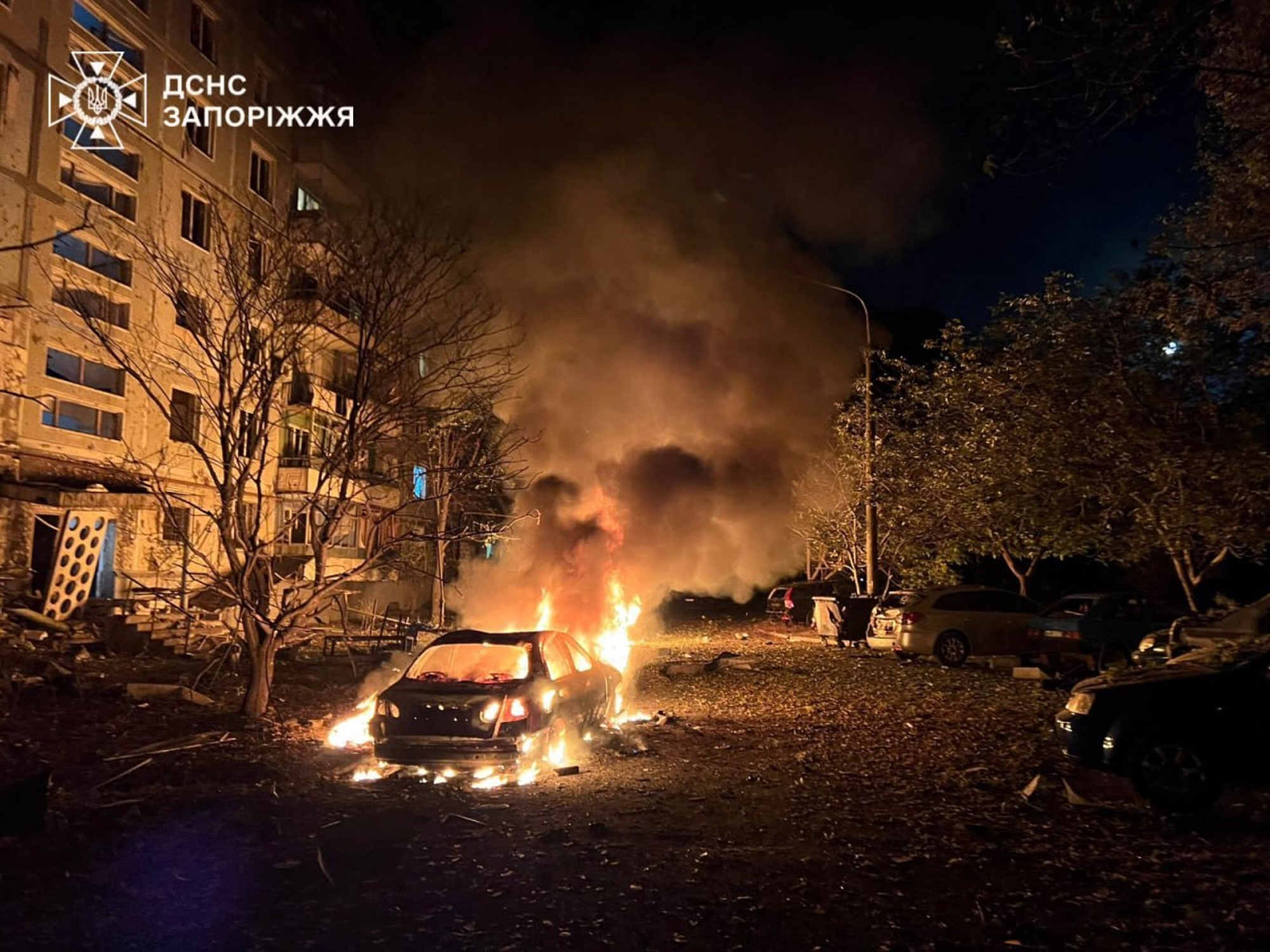In this photo provided by the Ukrainian Emergency Service, fire and smoke raises after a residential building was damaged during Russia